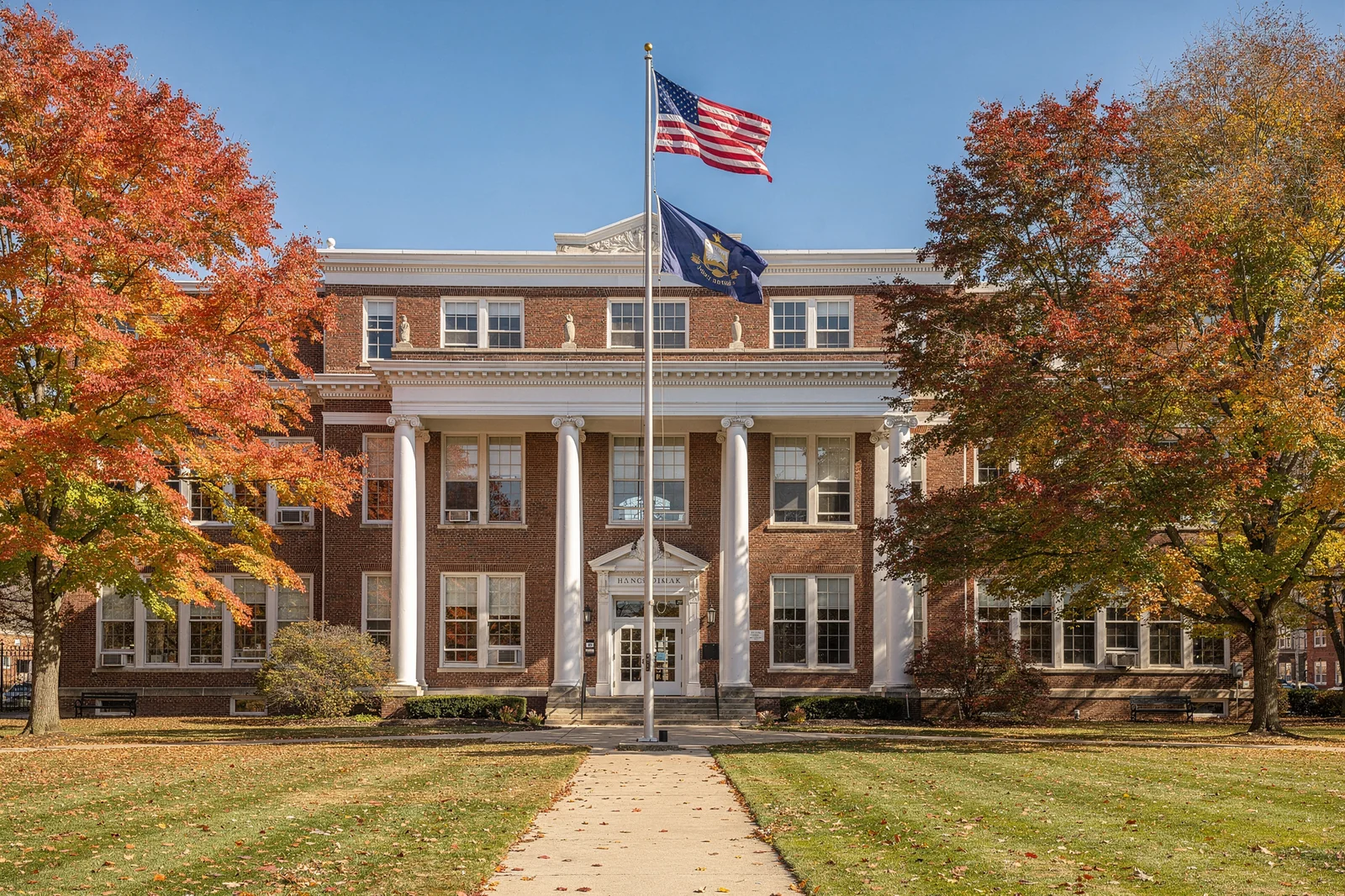 New York State K-12 public school building with American and state flags